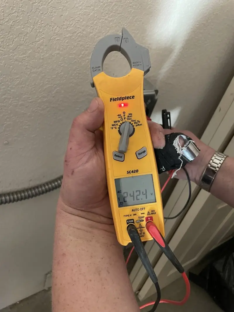 Voltage testing with clamp meter during Outlet Installation in James Island